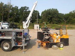 Service truck with specialized equipment being serviced on site